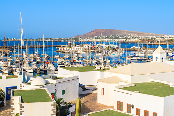 View of marina Rubicon and typical Canary style houses in Playa Blanca town, Lanzarote island, Spain